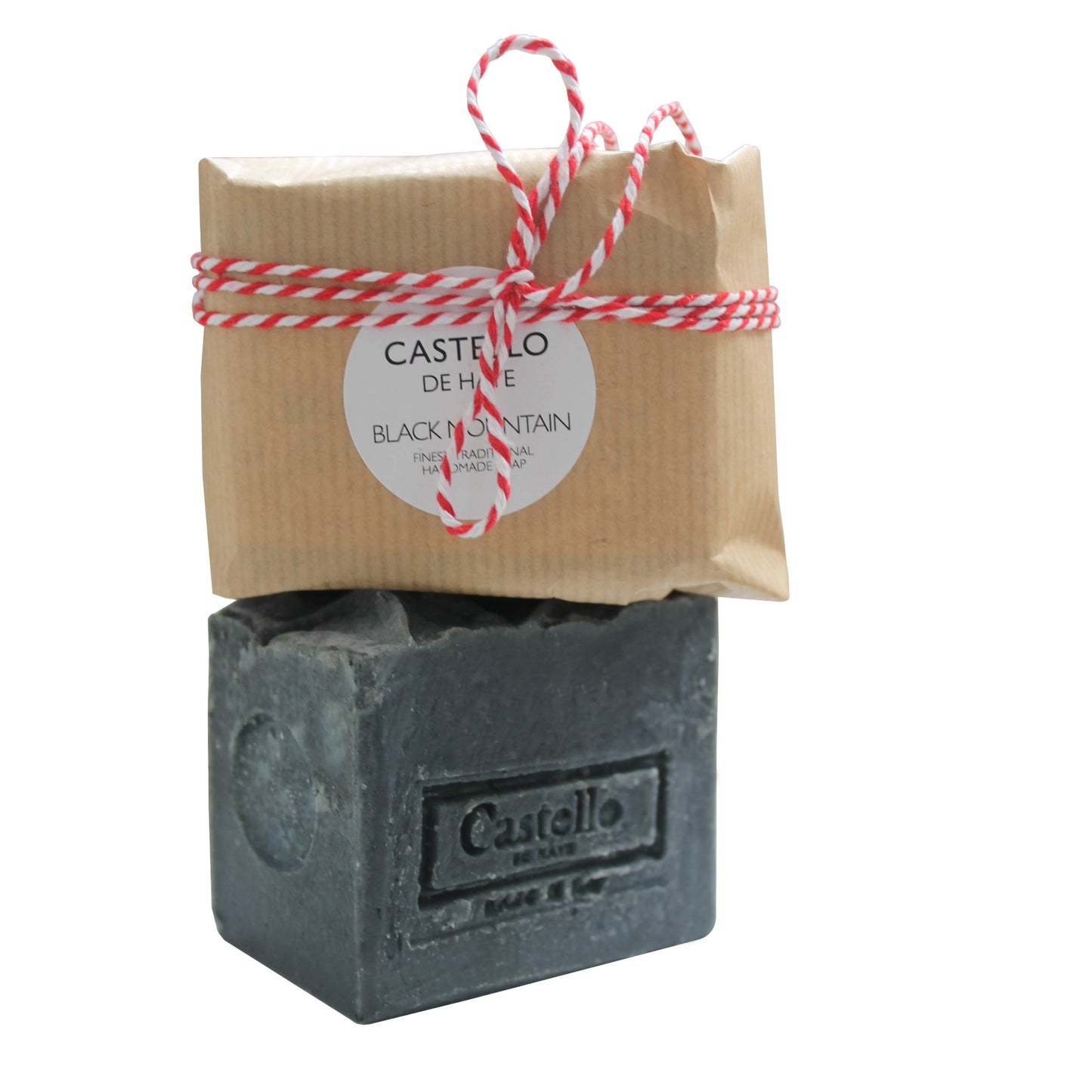 A packaged charcoal soap bar with 'Castello de Haye' branding, wrapped in sustainable kraft paper and tied with bakers twine.