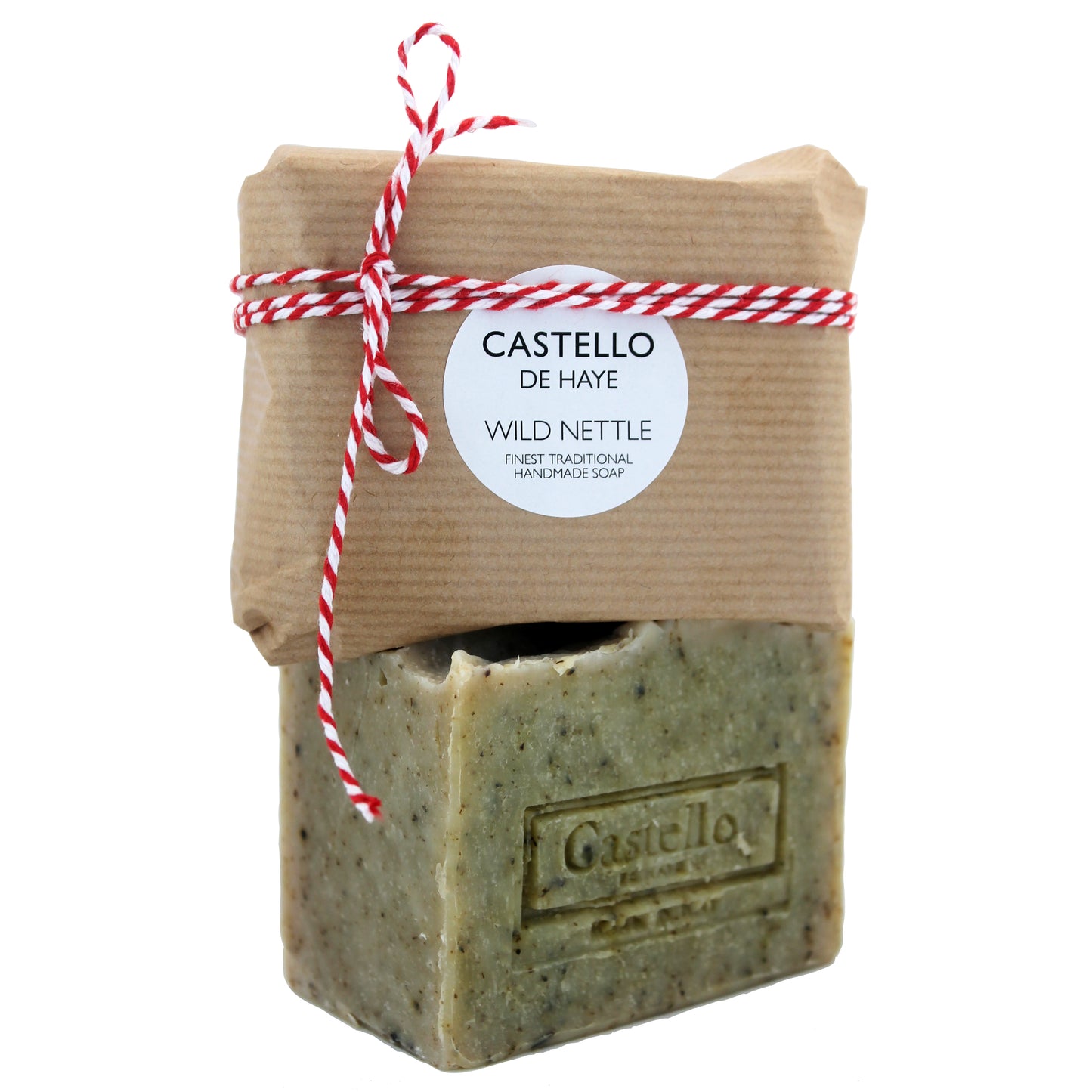 A bar of soap with 'Castello' branded on it, wrapped in beige kraft paper with a red and white string, indicating it is handmade with nettle and verbena.