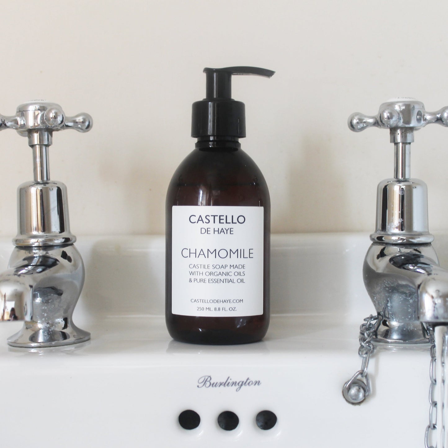 Castello de Haye Chamomile Castile Soap on bathroom sink in between 2 taps