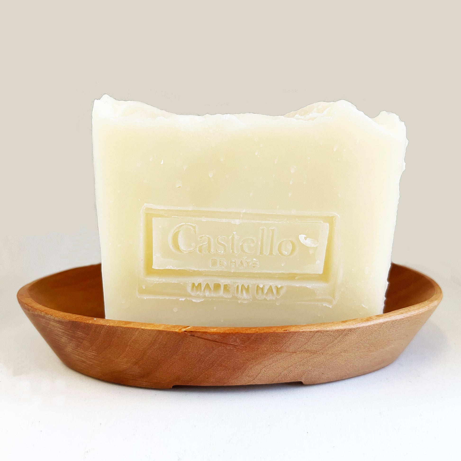 Handmade Castello de Haye soap, natural soap in wooden soap dish with white background