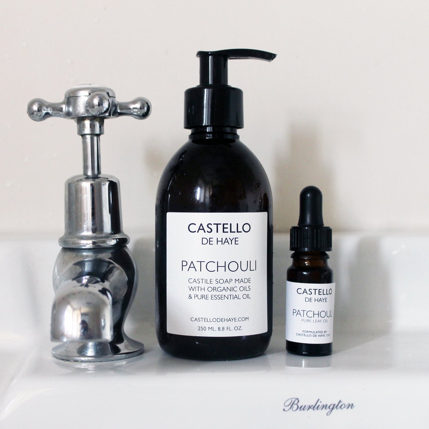 Patchouli castile soap next to a 10ml bottle of pure essential oils