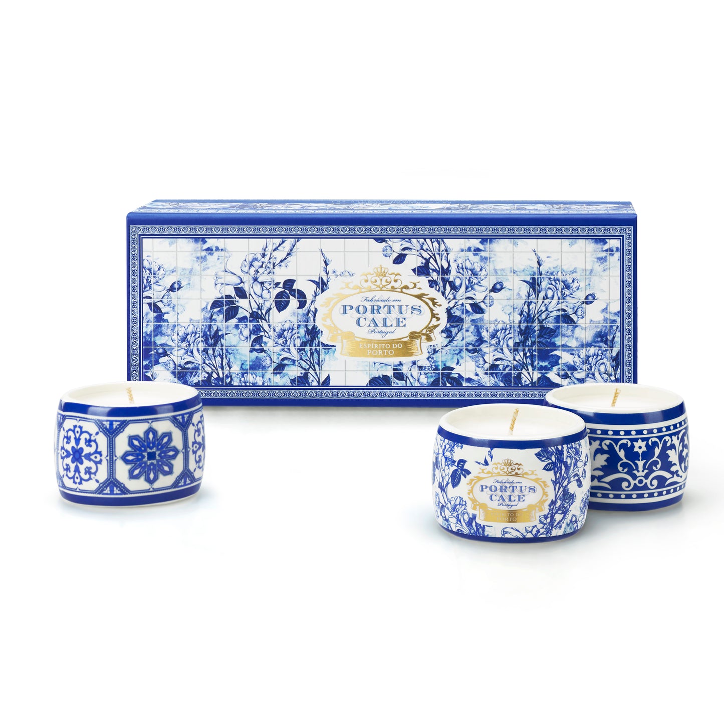 A set of three Portus Cale scented candles with blue and white floral tile patterns on the ceramic containers, presented with a matching box.