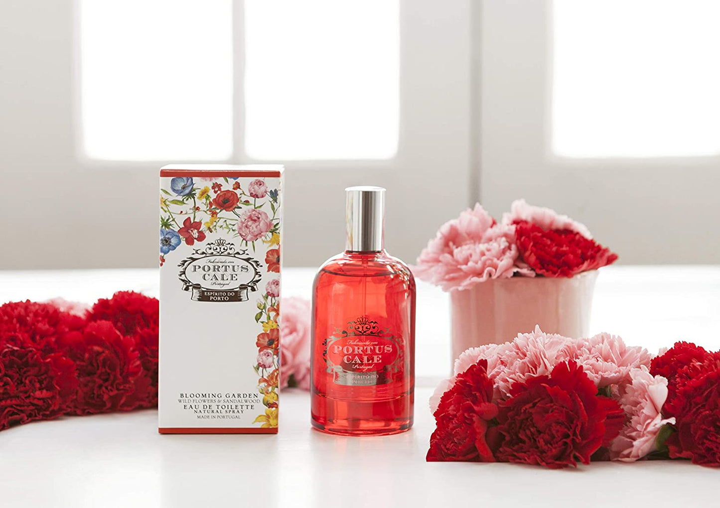 Portus Cale Blooming Garden Eau de Toilette styled with red and pink wild flower blooms