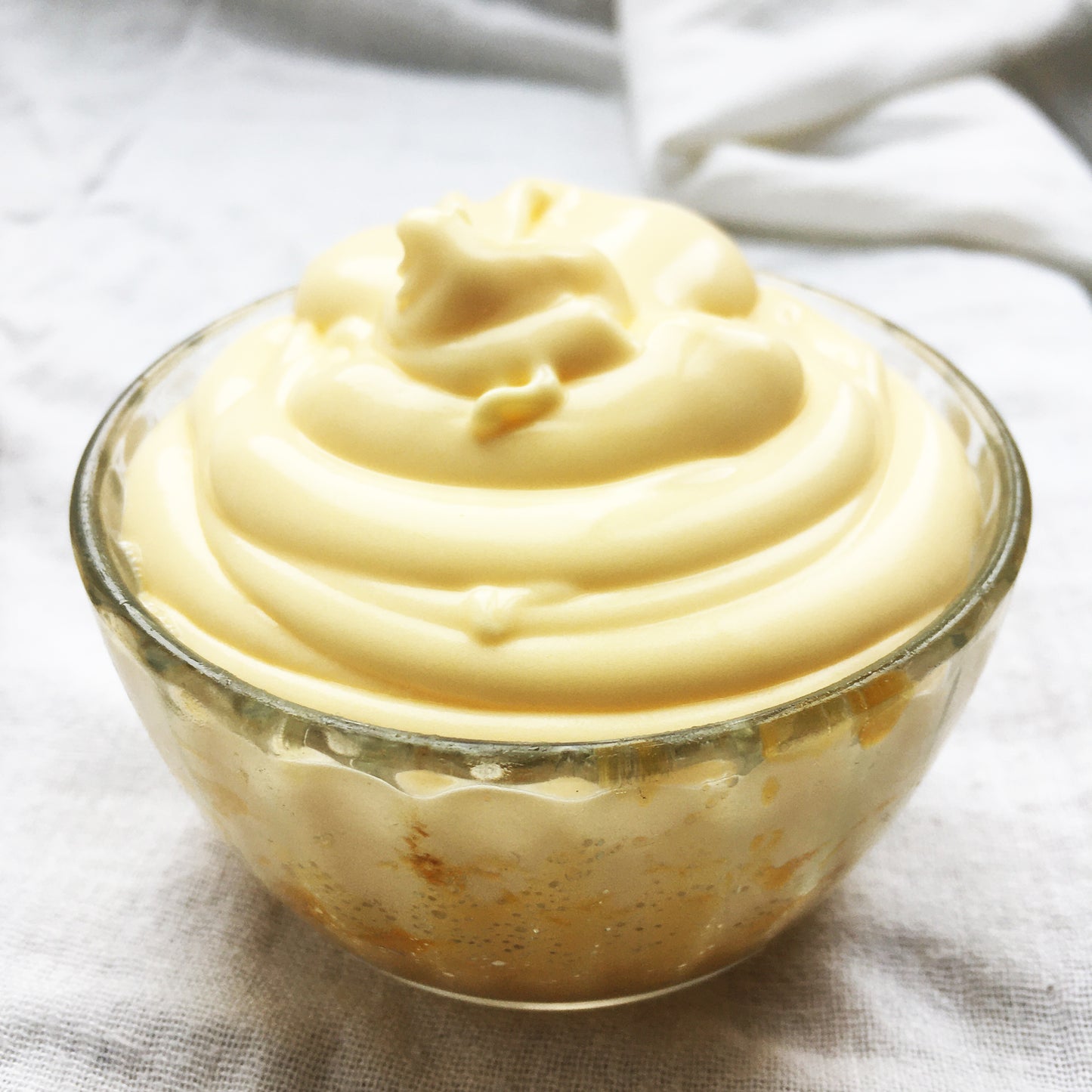 Rich Balm in a glass jar on a linen base