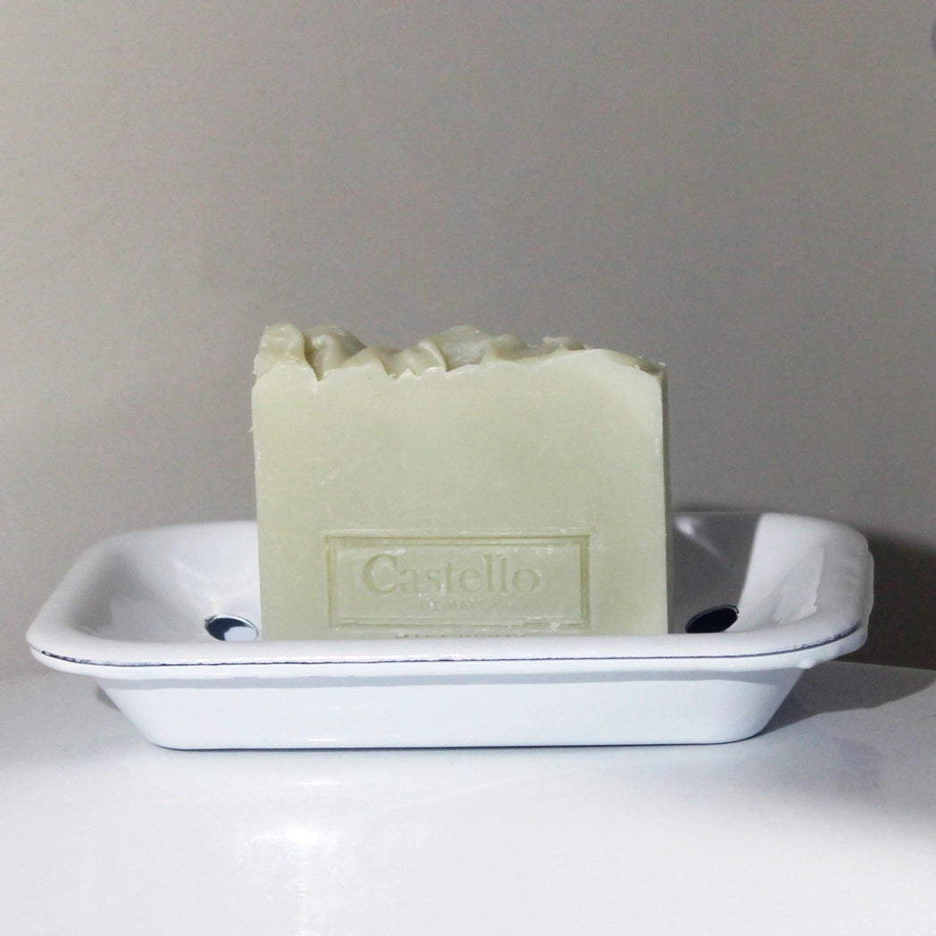 Castello de Haye Soap on pure white enamel soap dish on side of bath
