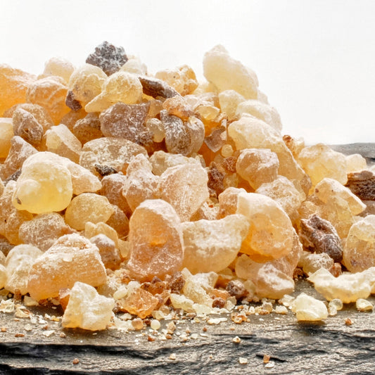 Golden nuggets of Frankincense resin on a slate tray