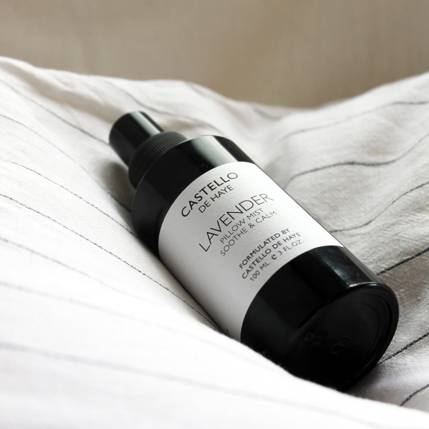Castello de Haye Lavender room spray, on a linen pillow