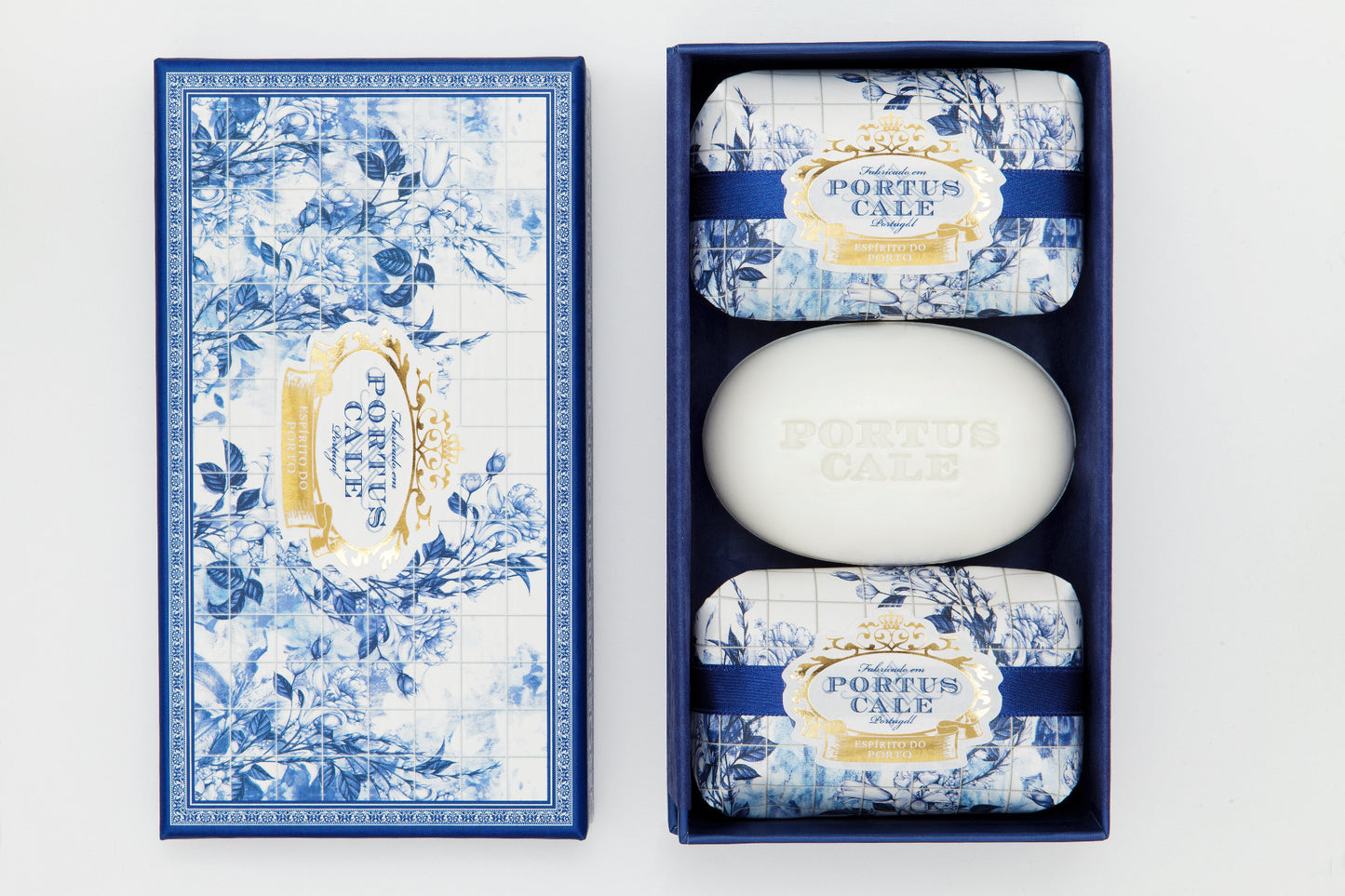 A set of three Portus Cale Gold & Blue soaps with floral motifs on the packaging, displayed in a blue box.