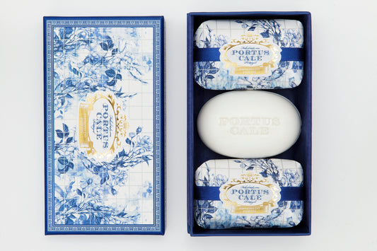 A set of three Portus Cale Gold & Blue soaps with floral motifs on the packaging, displayed in a blue box.