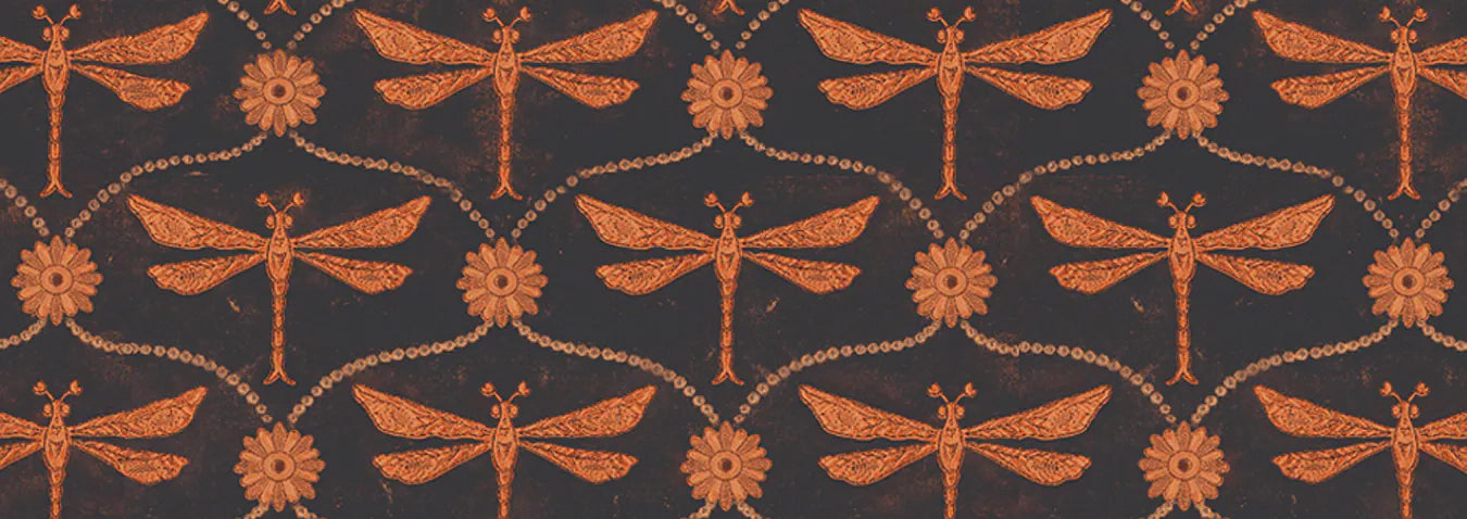 Pattern of orange dragonflies and flowers on a dark background