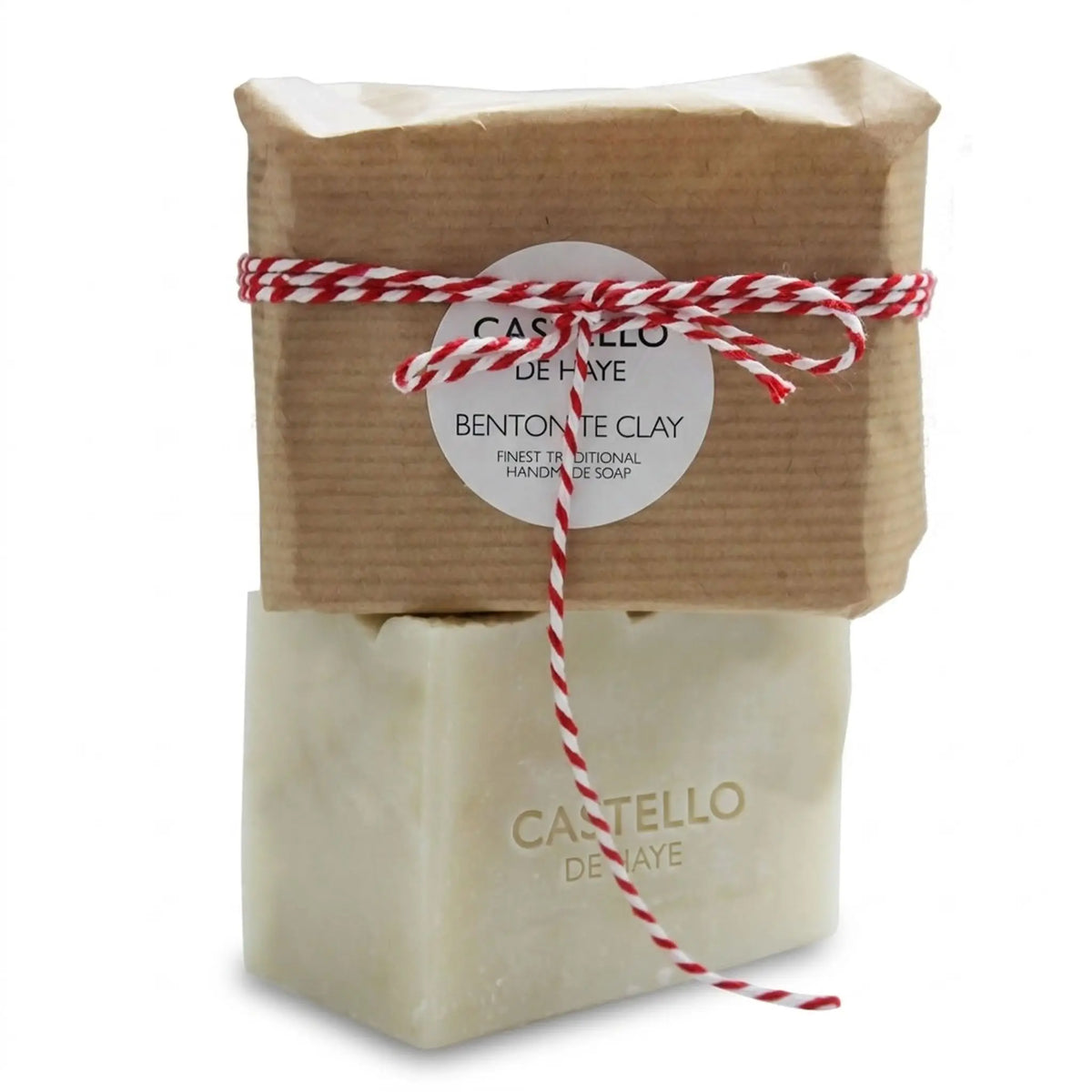Bentonite Clay soap wrapped in kraft paper with twine on top of unwrapped soap with imprint