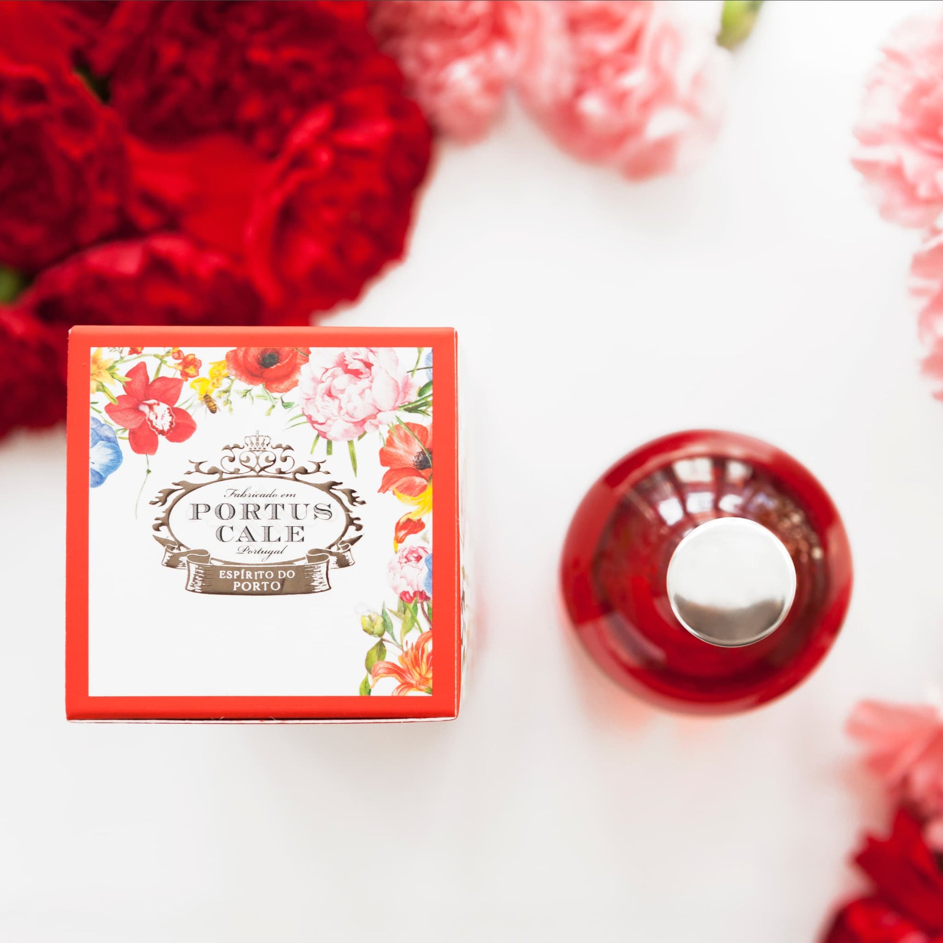 Portus Cale Blooming Garden Eau de Toilette styled with red and pink wild flower blooms from above