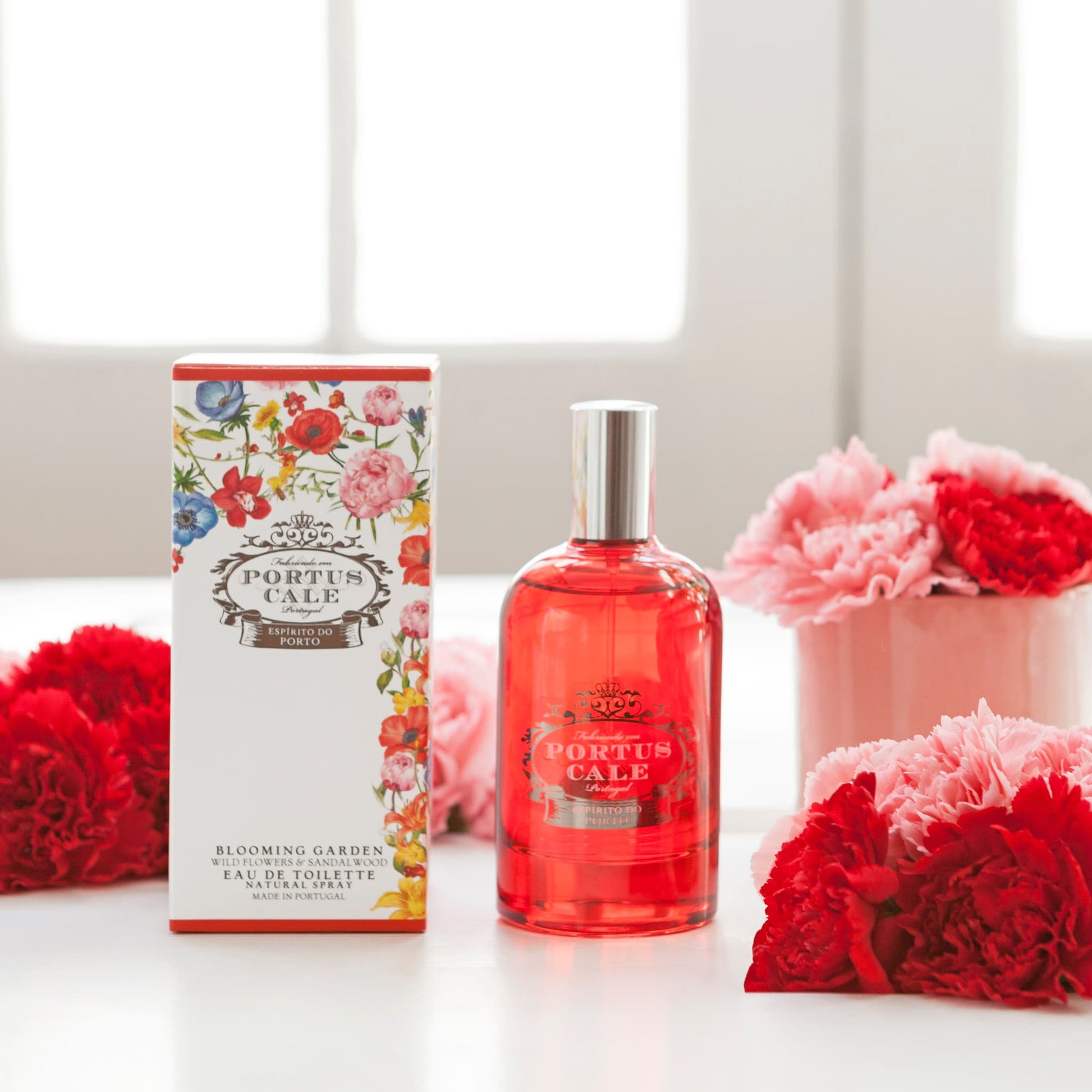 Portus Cale Blooming Garden Eau de Toilette styled with red and pink wild flower blooms