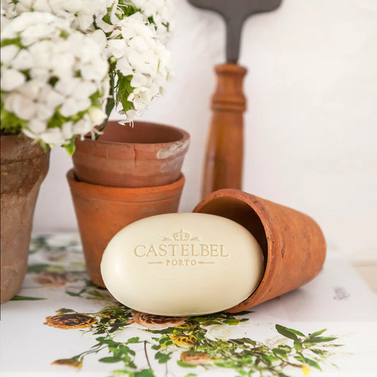 Castelbel Verbena soap bar in lifestyle images with plant pots and verbena plants – Portuguese luxury soap