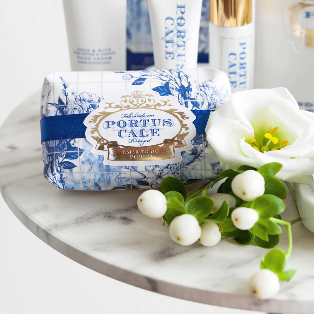 Portus Cale soap with flowers on a marble surface