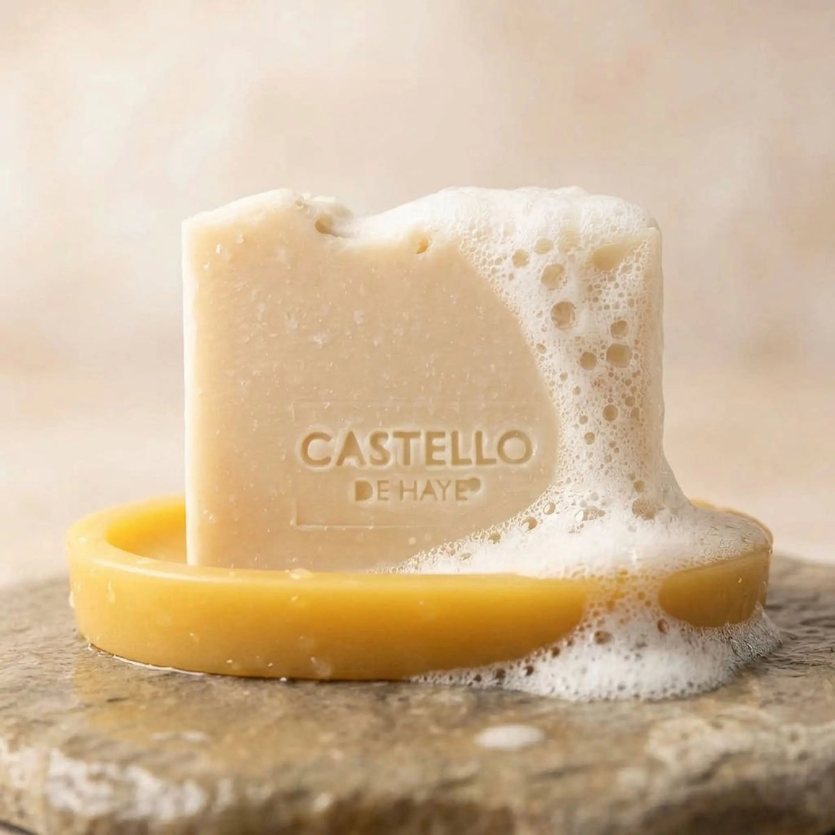 Castello de Haye natural soap bar lathering on beeswax soap dish, moisturising and gentle for sensitive skin