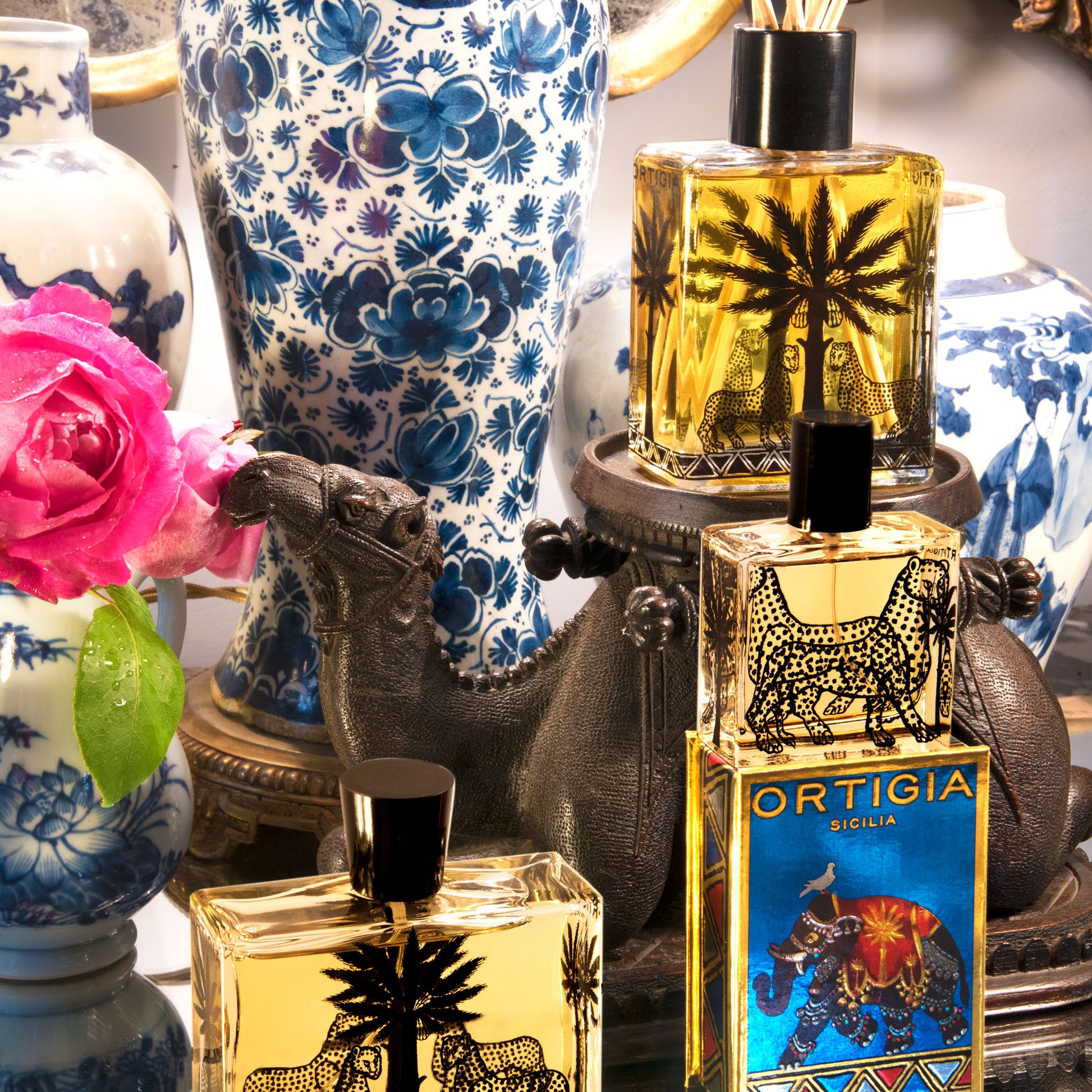 Ortigia perfume bottles with Sandalo 30ml box with vases in the background.