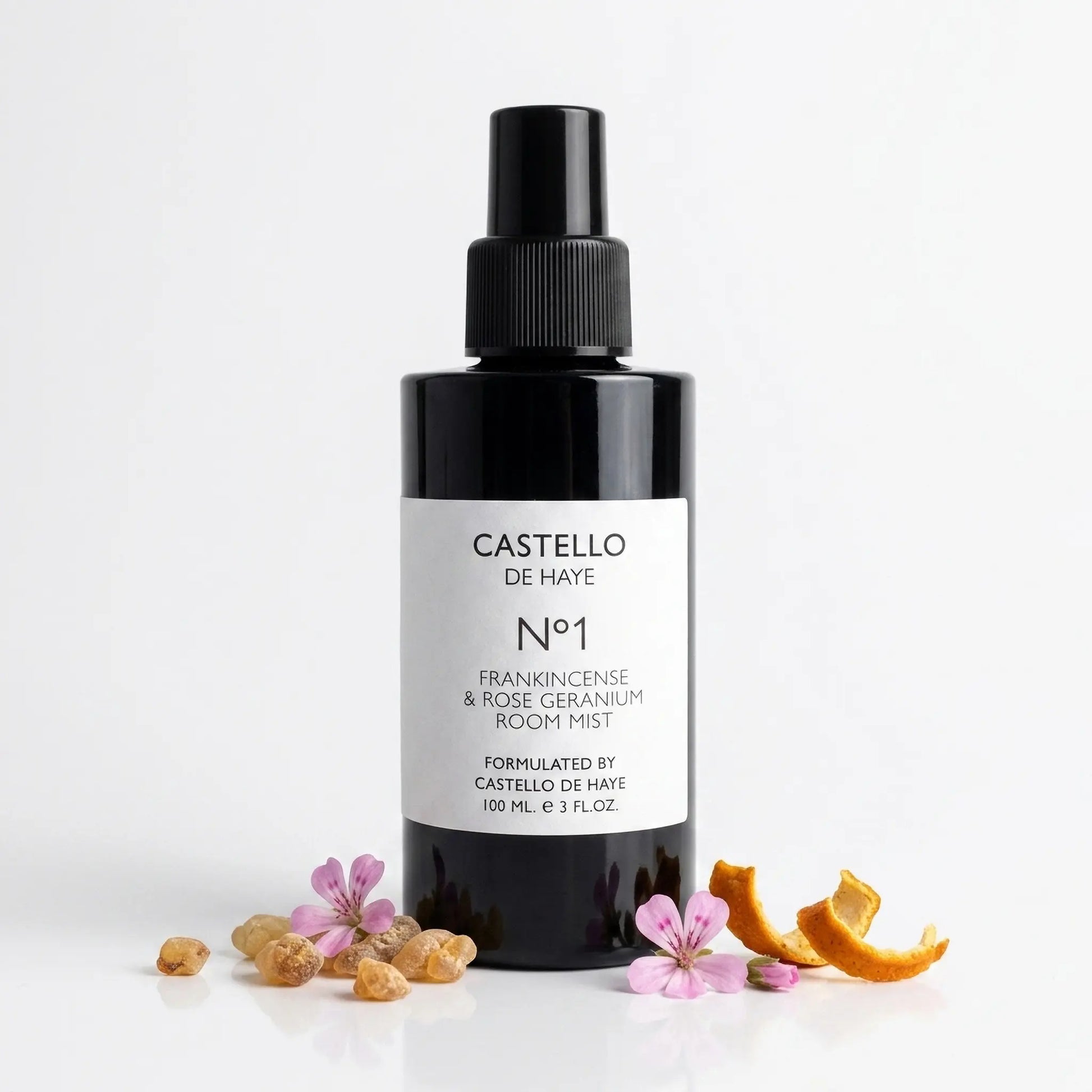 Castello de Haye No. 1 Frankincense & Rose Geranium Room Mist, with scattered botanicals