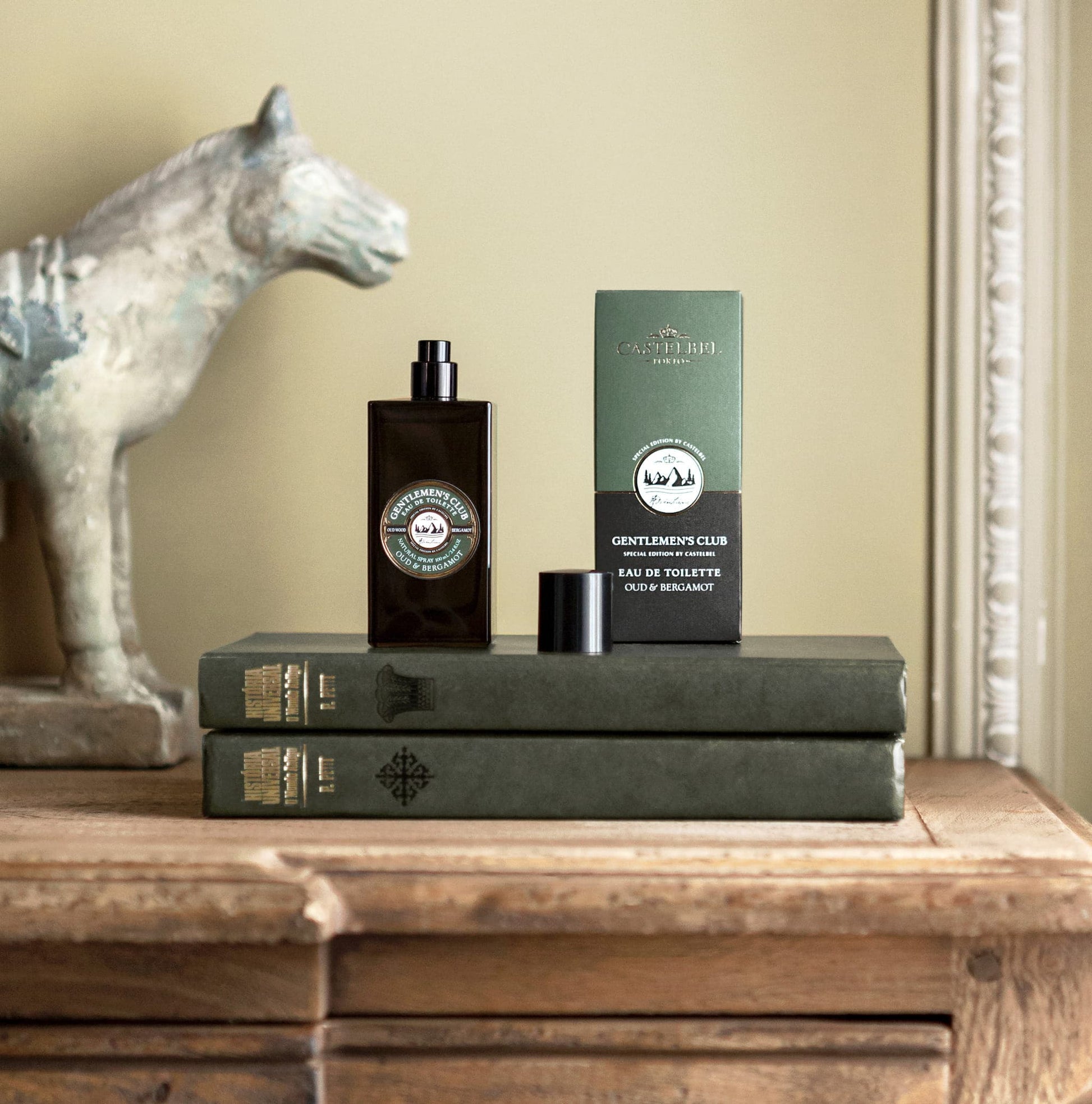 Castelbel Gentlemen's Club Oud & Bergamot Eau de Toilette styled on a wooden table with books and packaging in the background