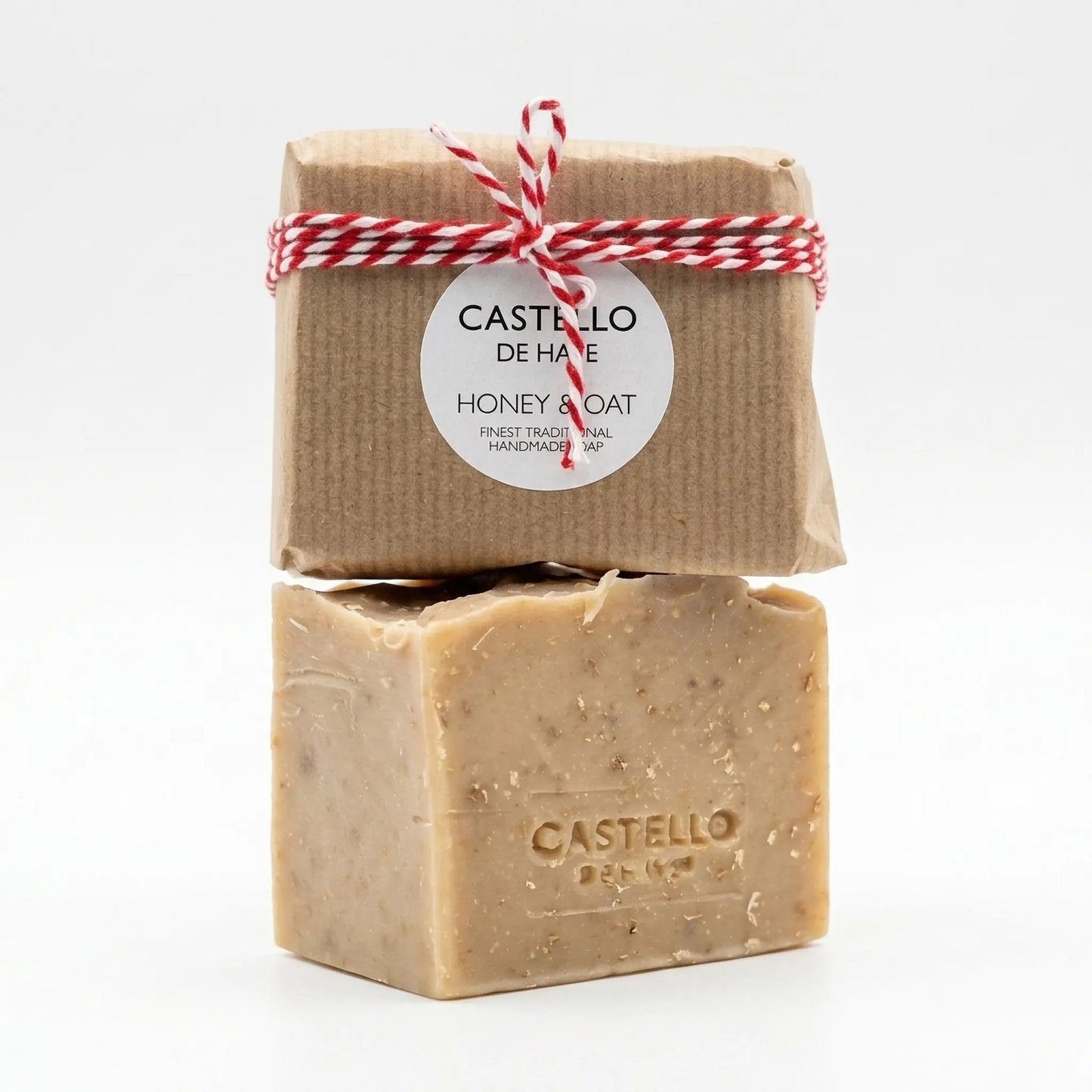 Castello de Haye Honey & Oat finest traditional handmade soap with Kraft paper packaging and red twine.