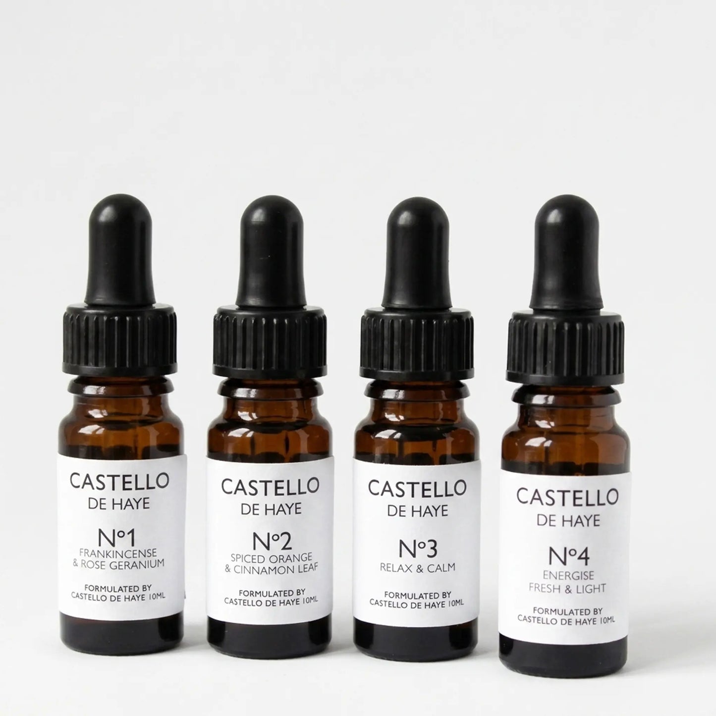 Castello de Haye pure essential oil range — No.1, No.2, No.3 and No.4 amber apothecary dropper bottles on grey background