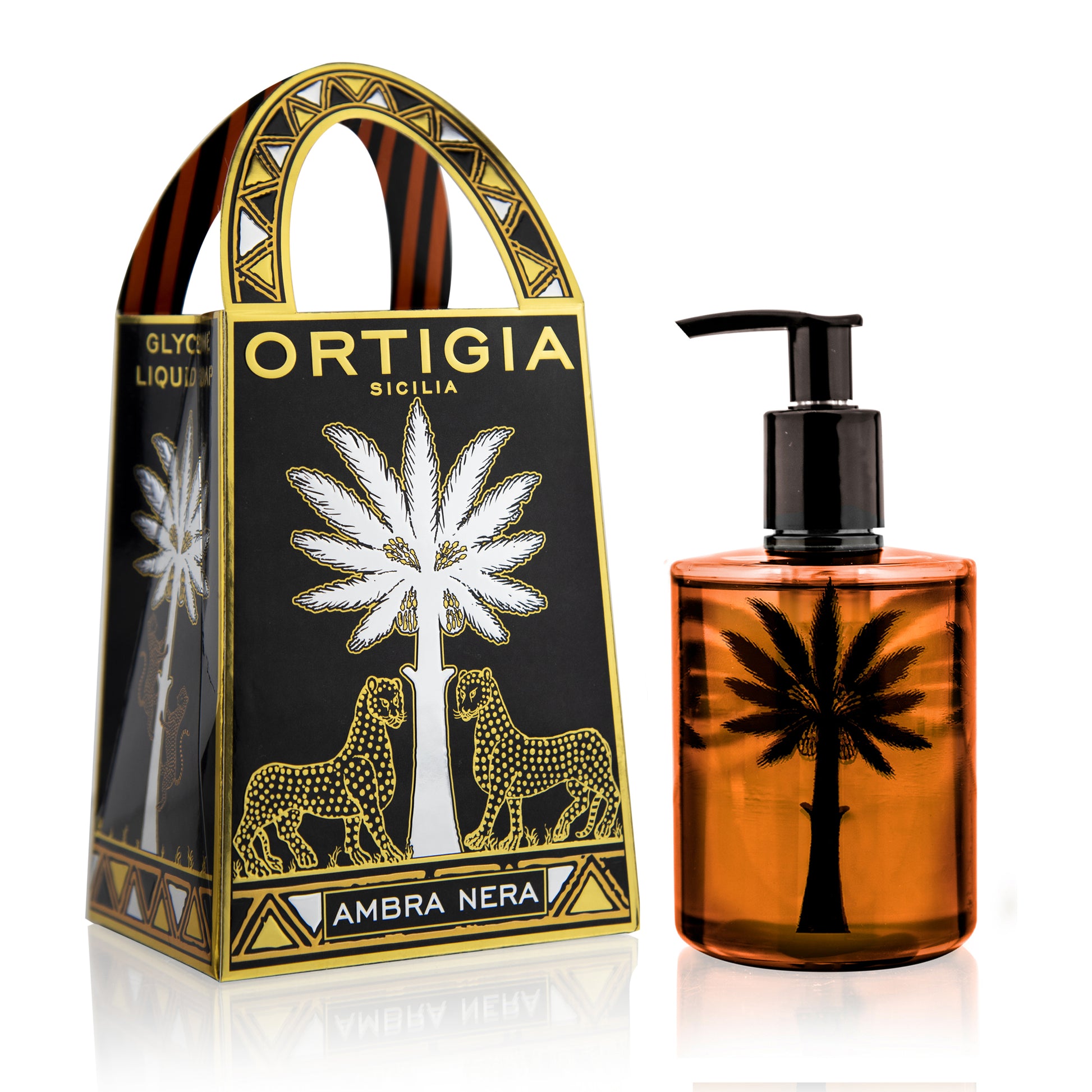 Ortigia Ambra Nera liquid soap in a clear bottle with a black pump, alongside its packaging which features black and gold colors with a palm tree and leopard graphics.