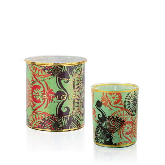 Two cylindrical glass jars with gold hand decorated patterns, one larger and one smaller, both with a gold rim. Fico d'India Candle with gold leaf