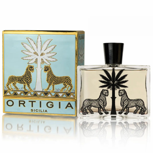 Ortigia Sicilia perfume bottle and packaging with palm tree and lion design on a white background