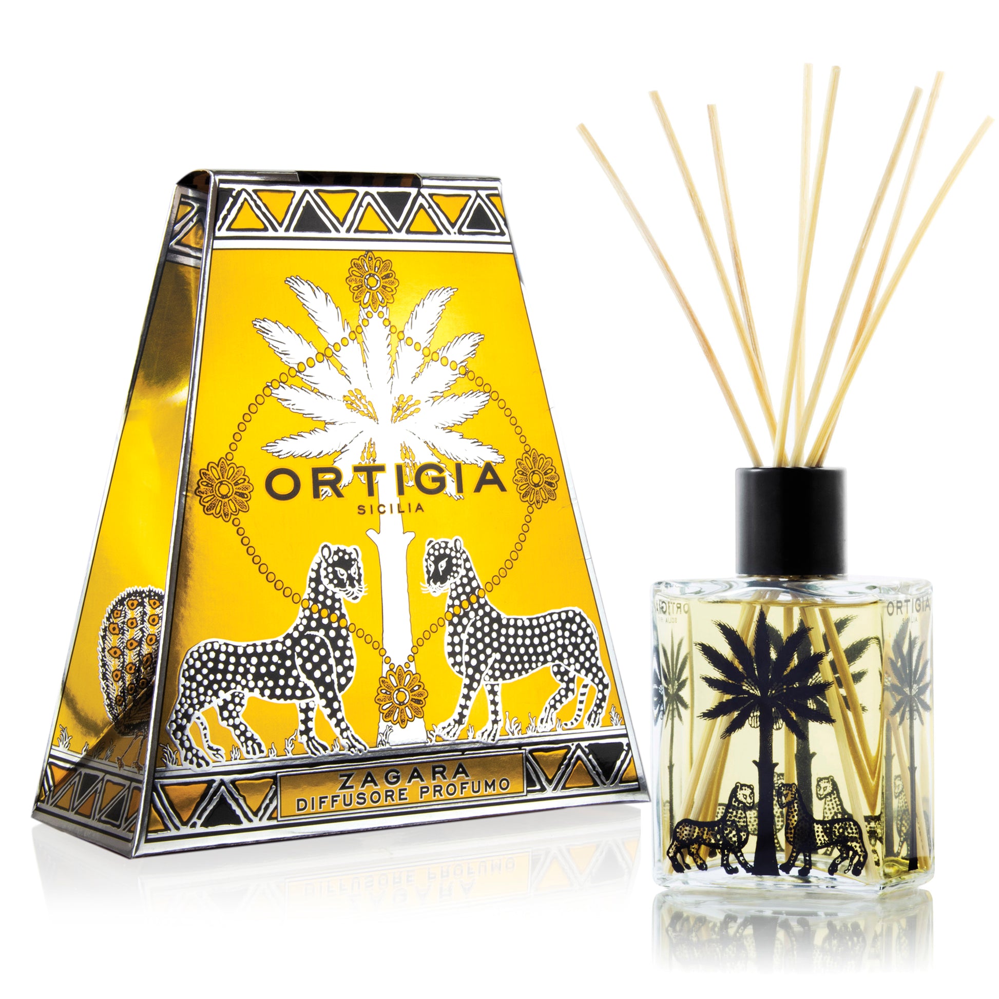 Ortigia Zagara perfume diffuser product with a decorative box, featuring illustrations of citrus fruits and leaves, and a clear bottle with orange-colored liquid and natural reeds inside.