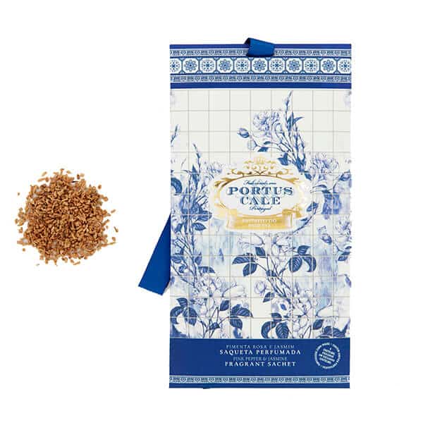 Portus Cale fragrant sachet with a scattering of cork material on a white background Gold and Blue pink pepper and jasmine