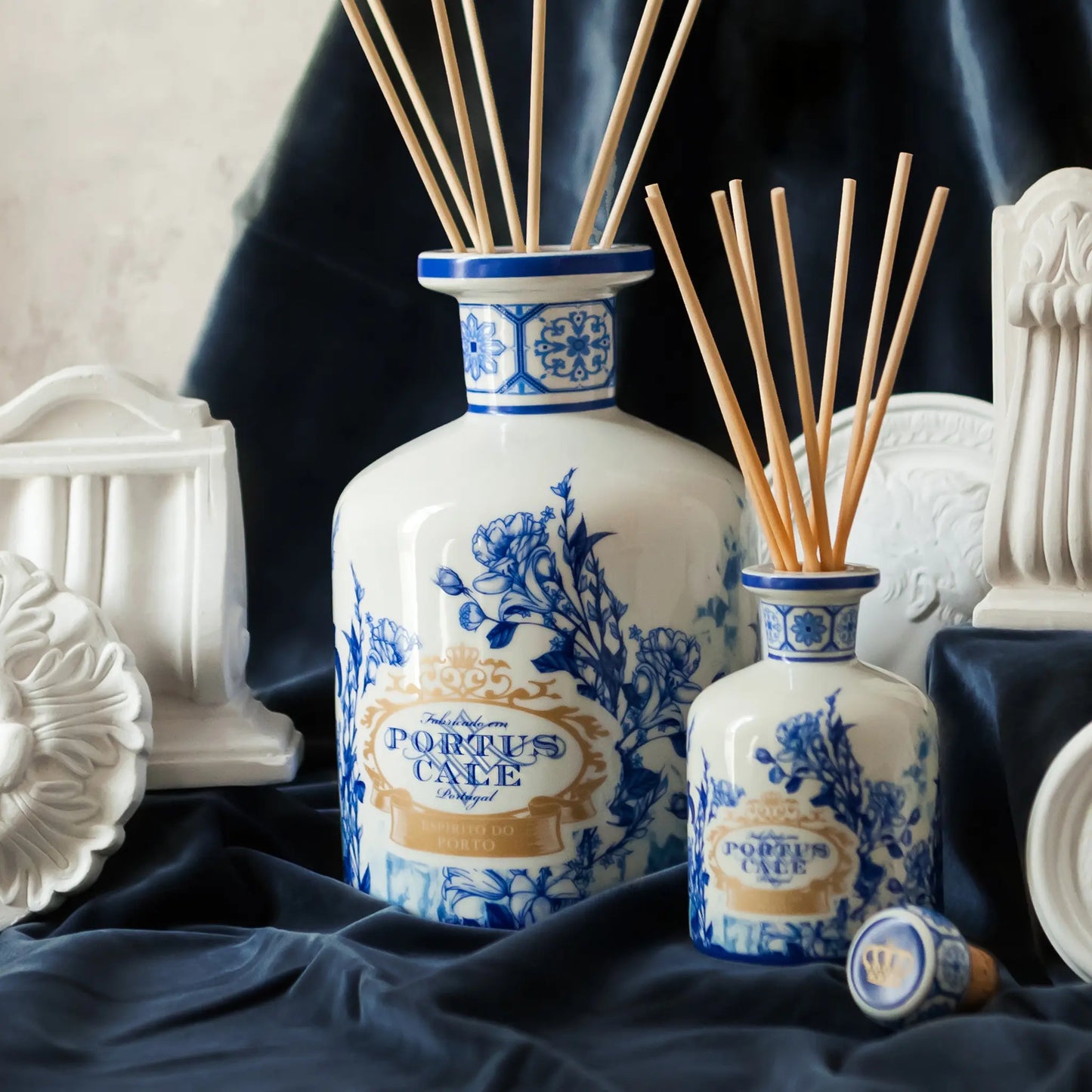 Portus Cale Gold & Blue ceramic reed diffuser 250ml — pink pepper and jasmine — ceramic jars on blue velvet lifestyle