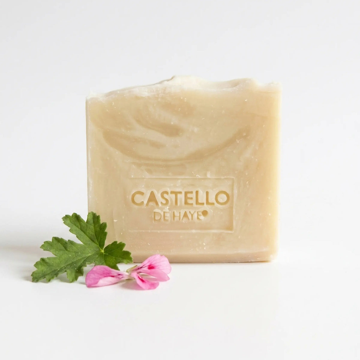 Castello de Haye Rose Geranium & Beeswax Soap Bar 200g with pelargonium petals on a white background