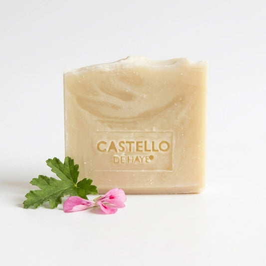Castello de Haye Rose Geranium & Beeswax Soap Bar 200g with pelargonium petals on a white background
