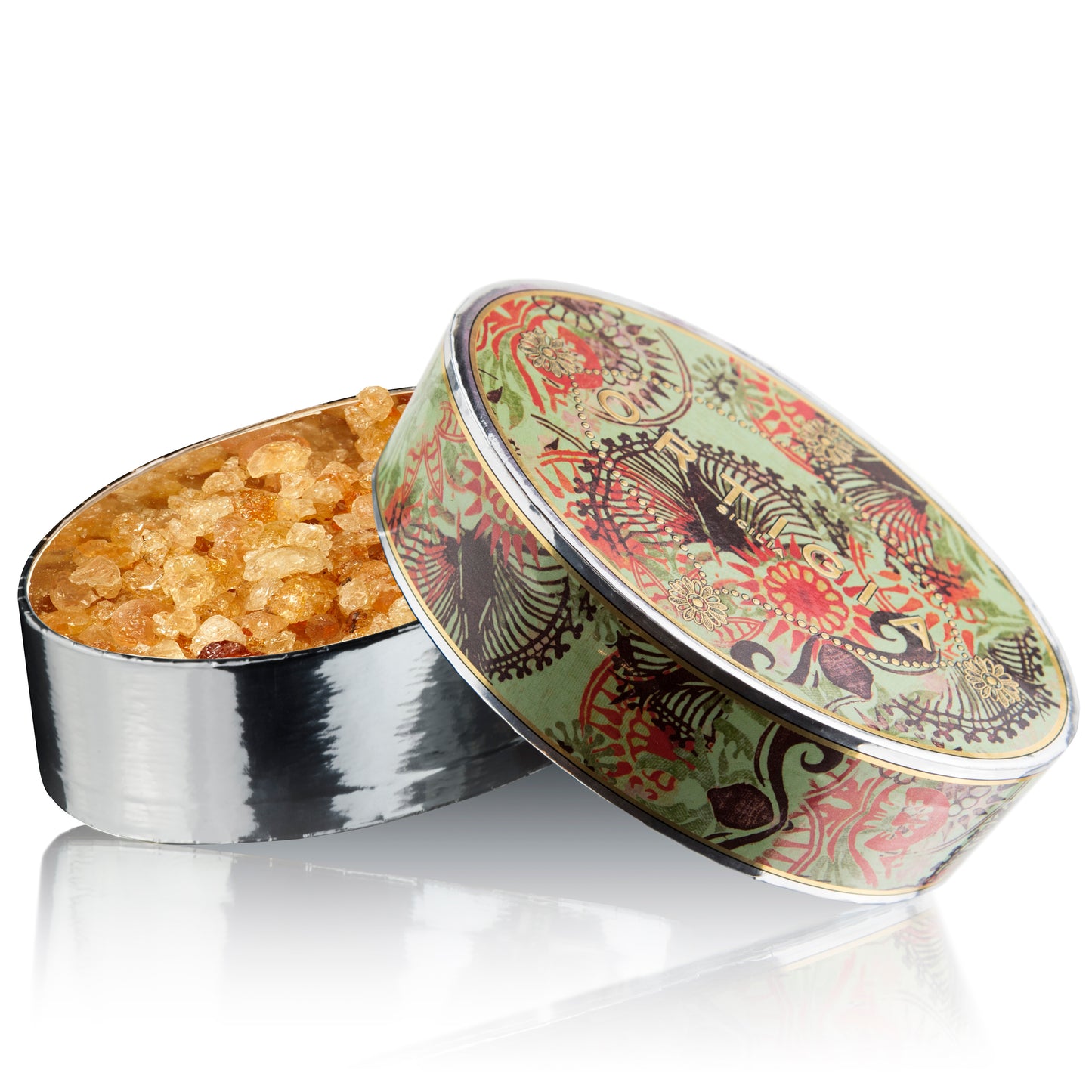 A container with a decorative lid, partially filled with glittery, amber-colored scent crystals.