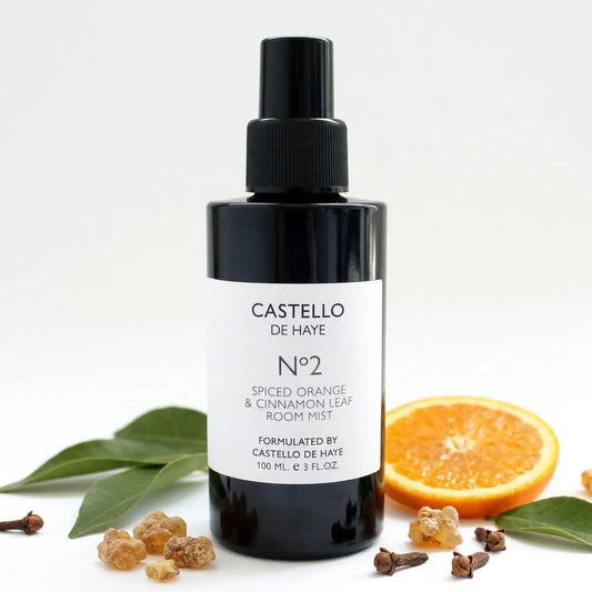 No.2 Spiced Orange & Cinnamon Leaf room spray, 100ml bottle with orange, leaves, cloves and frankincense resin.