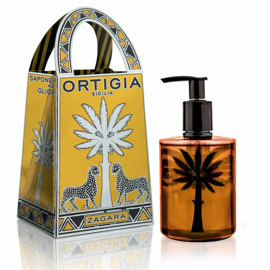 Ortigia Zagara liquid soap in a clear pump bottle, with a decorative yellow package featuring palm trees and the brand name.